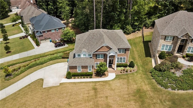 view of front facade featuring a garage and a front lawn