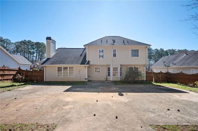 3090 Perch Ln SW, Marietta, GA 30008 - rear view of property with a chimney, a patio area, and concrete driveway