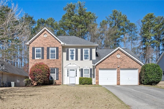 3090 Perch Ln SW, Marietta, GA 30008 - colonial-style house featuring brick siding, a garage, driveway, and cooling unit