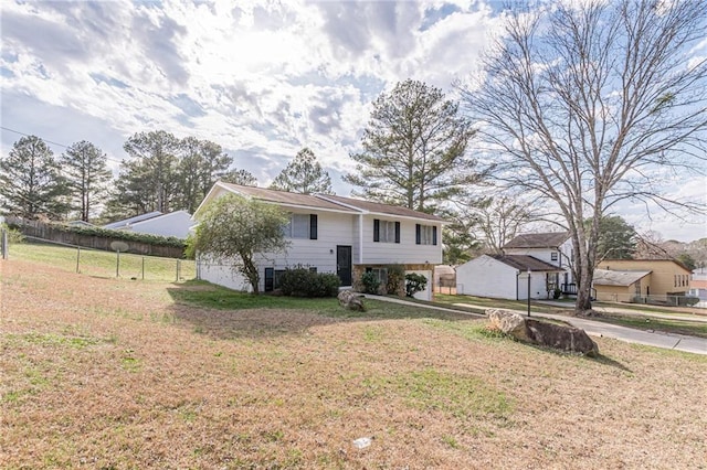 raised ranch with a front yard