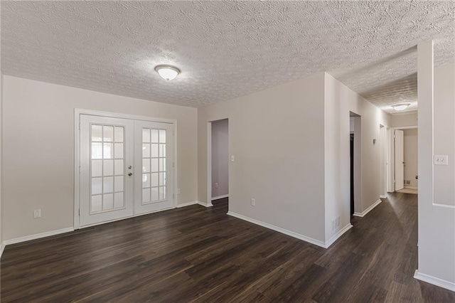 entrance foyer featuring dark hardwood / wood-style flooring, french doors, and a textured ceiling