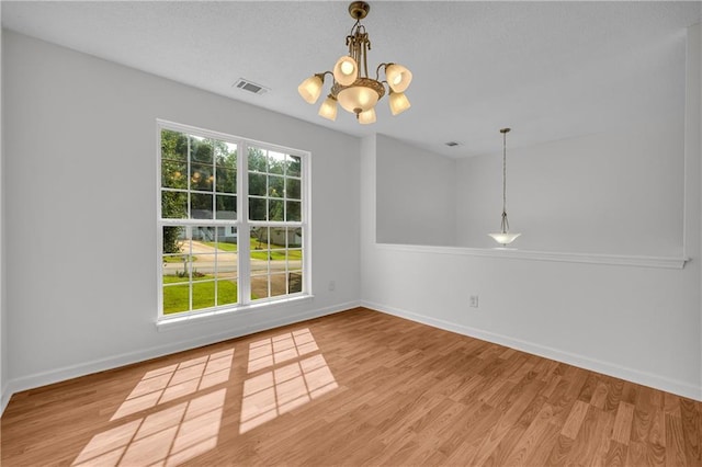 6440 Narramore Way, Lula, GA 30554 - empty room with a chandelier, wood finished floors, and baseboards