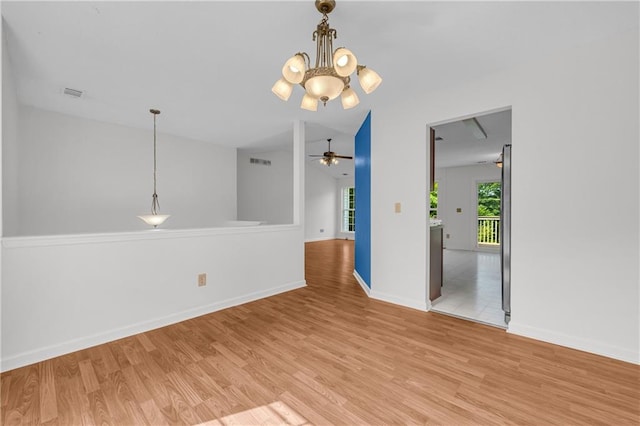 6440 Narramore Way, Lula, GA 30554 - unfurnished room featuring a chandelier, light wood-style flooring, baseboards, and a ceiling fan