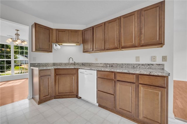 6440 Narramore Way, Lula, GA 30554 - kitchen featuring dishwasher, brown cabinets, a sink, a chandelier, and light flooring