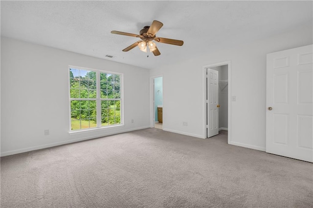 6440 Narramore Way, Lula, GA 30554 - unfurnished bedroom with baseboards, carpet, a spacious closet, and a ceiling fan