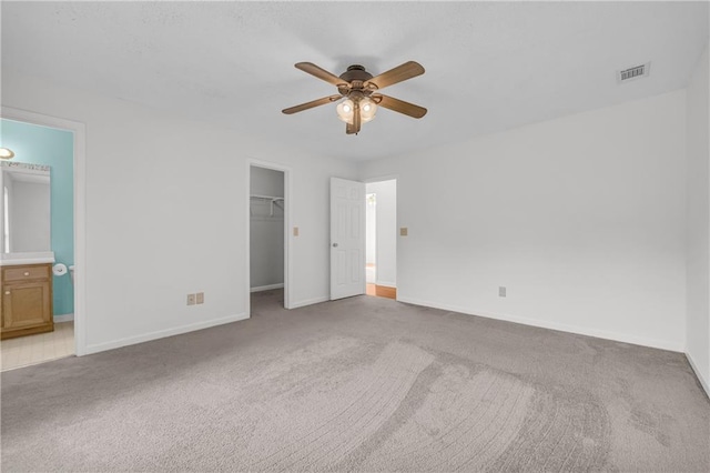 6440 Narramore Way, Lula, GA 30554 - unfurnished bedroom with carpet flooring, a walk in closet, baseboards, a closet, and ensuite bathroom