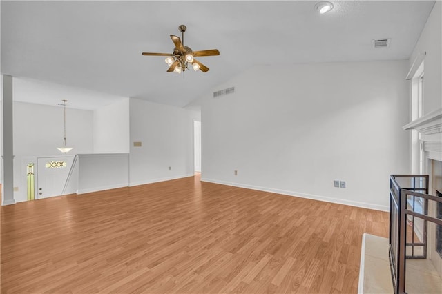6440 Narramore Way, Lula, GA 30554 - unfurnished living room with a ceiling fan, vaulted ceiling, light wood-style flooring, baseboards, and a fireplace
