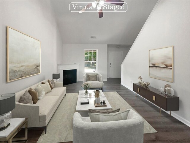 living room with ceiling fan, lofted ceiling, and dark hardwood / wood-style flooring