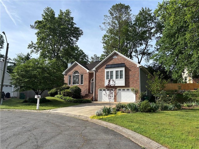 view of front of property featuring fence, an attached garage, brick siding, a front yard, and driveway