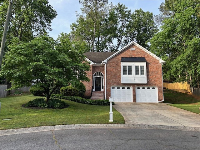 view of front of house featuring a front lawn, fence, brick siding, concrete driveway, and an attached garage
