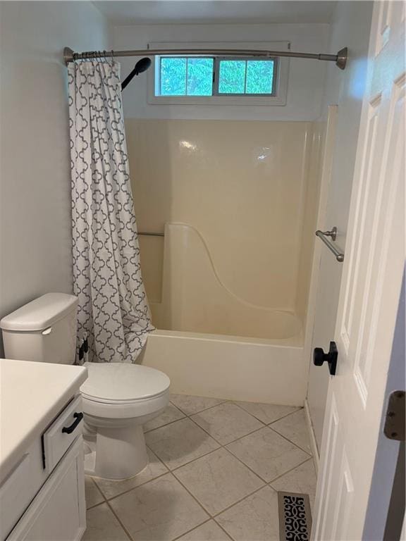 bathroom featuring vanity, toilet, tile patterned floors, shower / tub combo, and visible vents