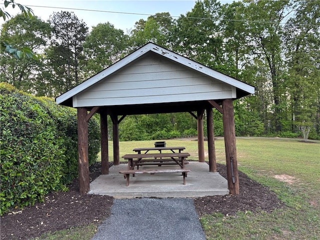 surrounding community with a gazebo and a lawn