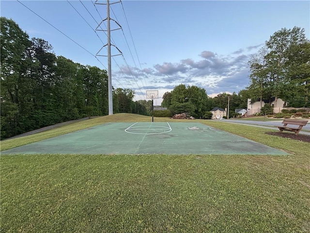 view of sport court featuring a yard and community basketball court