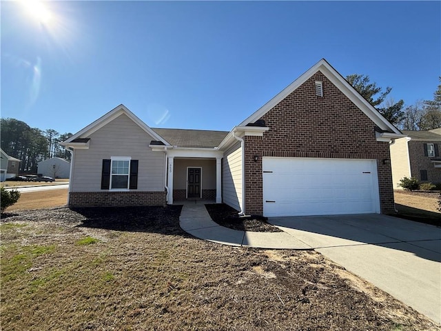 single story home featuring concrete driveway, brick siding, and an attached garage