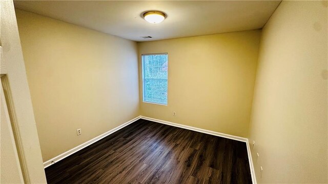 spare room with hardwood / wood-style floors