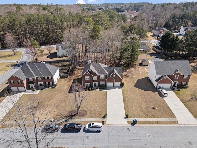 aerial view featuring a wooded view