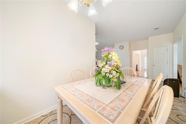 dining room featuring baseboards