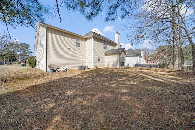 back of house featuring cooling unit