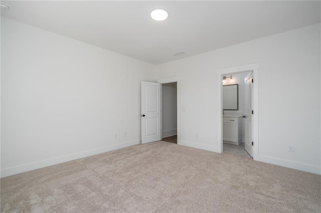 318 Reese Way, Ball Ground, GA 30107 - unfurnished bedroom with light colored carpet, baseboards, and ensuite bathroom