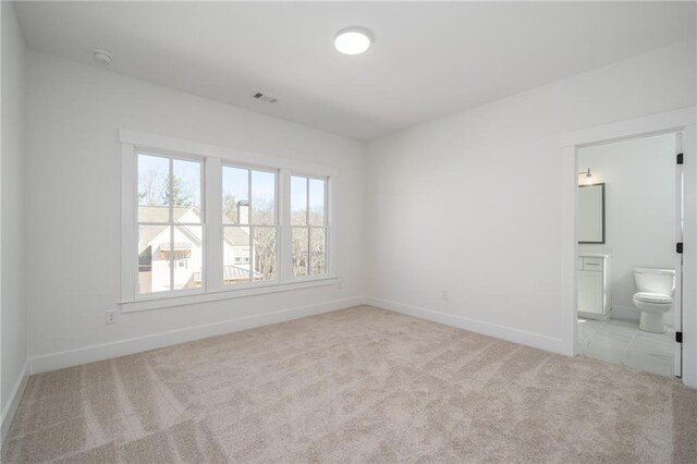 318 Reese Way, Ball Ground, GA 30107 - unfurnished bedroom with carpet flooring, baseboards, and ensuite bath