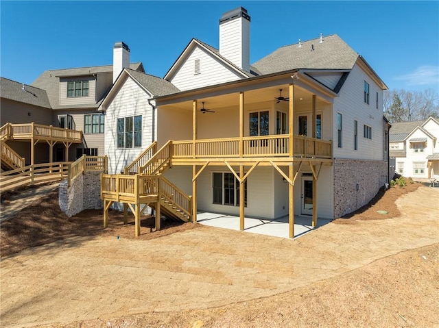 318 Reese Way, Ball Ground, GA 30107 - back of property with ceiling fan, stairway, a patio area, a chimney, and a wooden deck