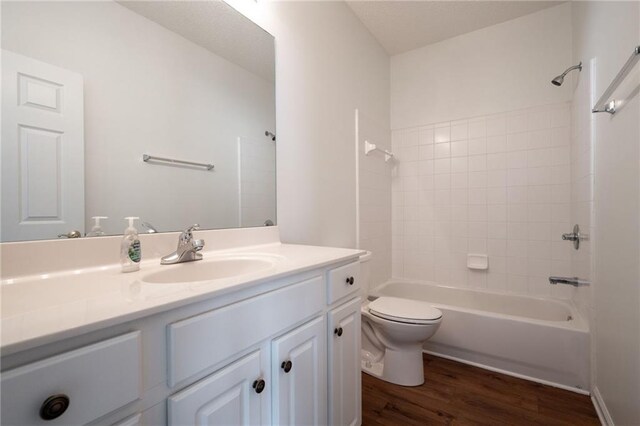 bathroom featuring an enclosed shower, toilet, and wood-type flooring