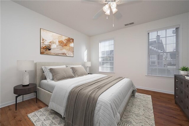 laundry room with hookup for an electric dryer, hardwood / wood-style floors, hookup for a washing machine, and an inviting chandelier