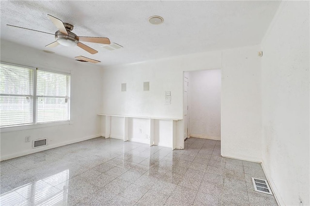 3221 Colquitt Dr, Atlanta, GA 30340 - unfurnished room featuring ceiling fan, visible vents, granite finish floor, and baseboards