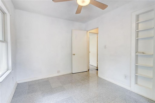 3221 Colquitt Dr, Atlanta, GA 30340 - unfurnished bedroom with baseboards, speckled floor, and ceiling fan