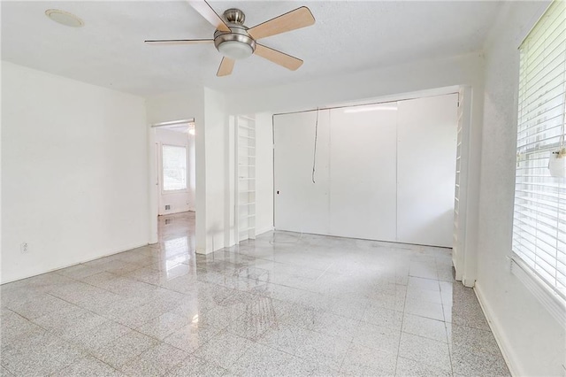 3221 Colquitt Dr, Atlanta, GA 30340 - unfurnished bedroom featuring baseboards, ceiling fan, a closet, and granite finish floor