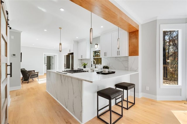 270 Boulder Dr, Roswell, GA 30075 - kitchen with light countertops, light wood-style flooring, stainless steel appliances, a sink, and recessed lighting