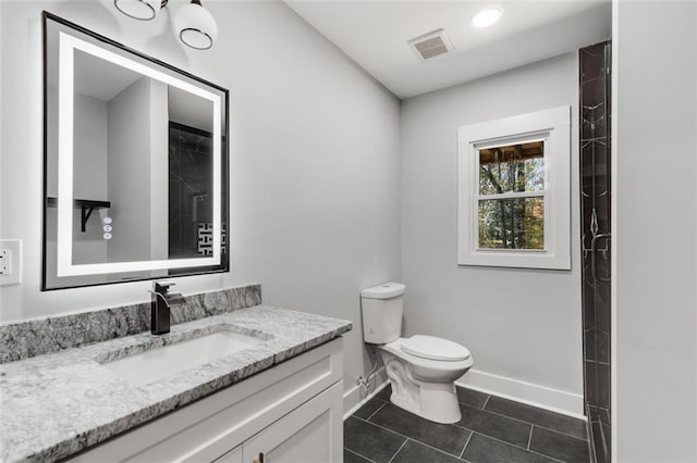270 Boulder Dr, Roswell, GA 30075 - full bath featuring baseboards, vanity, tile patterned floors, toilet, and a shower