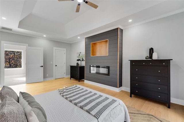 270 Boulder Dr, Roswell, GA 30075 - bedroom featuring wood finished floors, a raised ceiling, a fireplace, baseboards, and recessed lighting