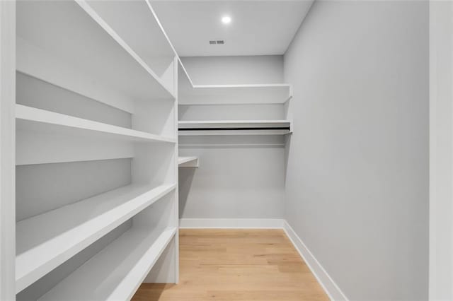 270 Boulder Dr, Roswell, GA 30075 - walk in closet featuring wood finished floors
