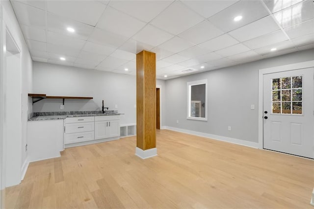 270 Boulder Dr, Roswell, GA 30075 - basement featuring light wood-type flooring, baseboards, a sink, a drop ceiling, and recessed lighting