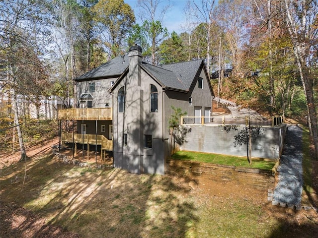 270 Boulder Dr, Roswell, GA 30075 - view of property exterior featuring a deck, a chimney, and a shingled roof