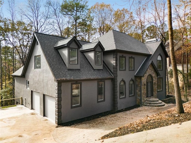 270 Boulder Dr, Roswell, GA 30075 - view of front of property with roof with shingles, a garage, stucco siding, and driveway