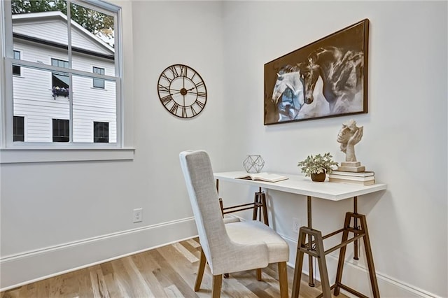 office area with light hardwood / wood-style flooring