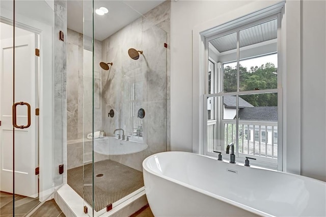 bathroom featuring tile patterned floors and independent shower and bath