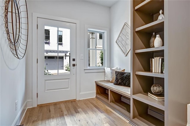 mudroom with light hardwood / wood-style floors