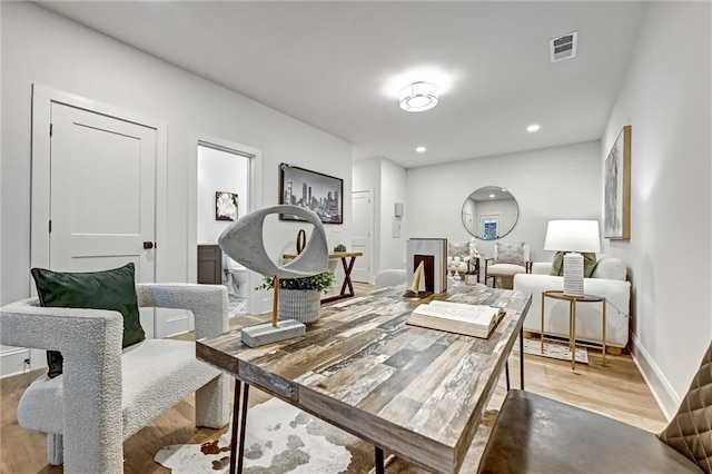 office space with light hardwood / wood-style floors