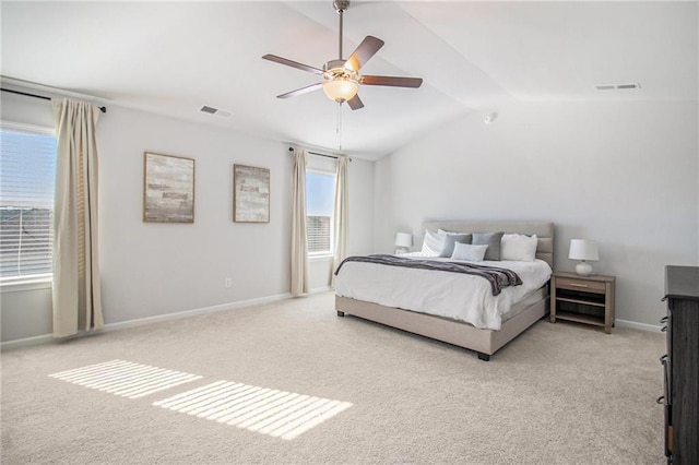 carpeted bedroom with ceiling fan and lofted ceiling