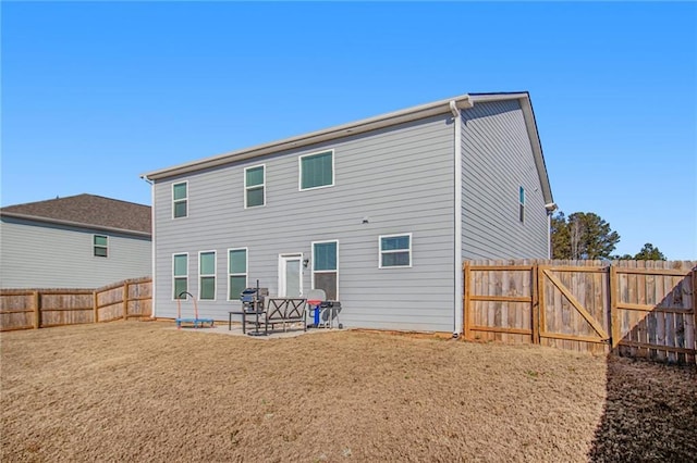 rear view of house with a patio