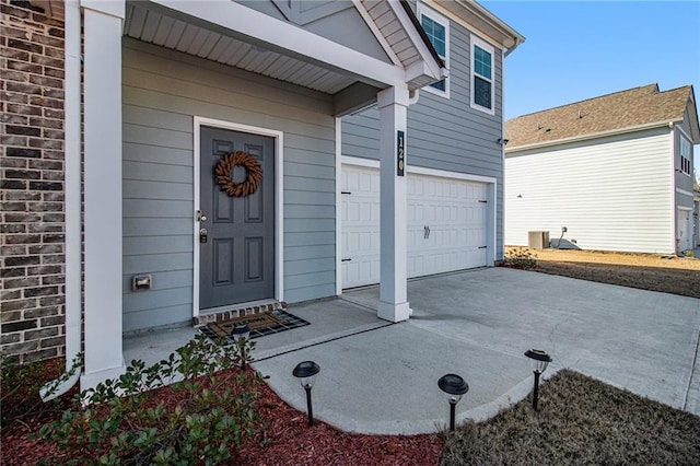 view of exterior entry featuring a garage