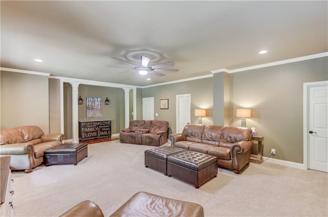 living room with crown molding, ceiling fan, decorative columns, and light carpet