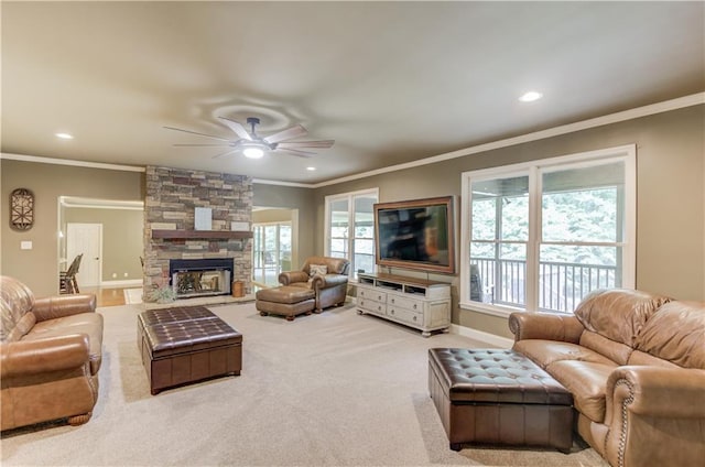 living room with ornamental molding, plenty of natural light, and light colored carpet