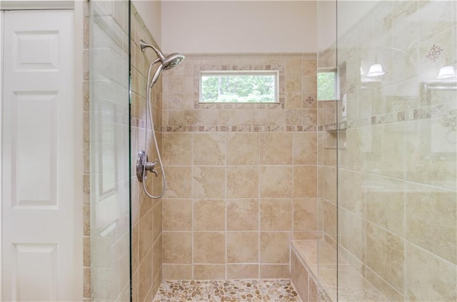 bathroom with a tile shower