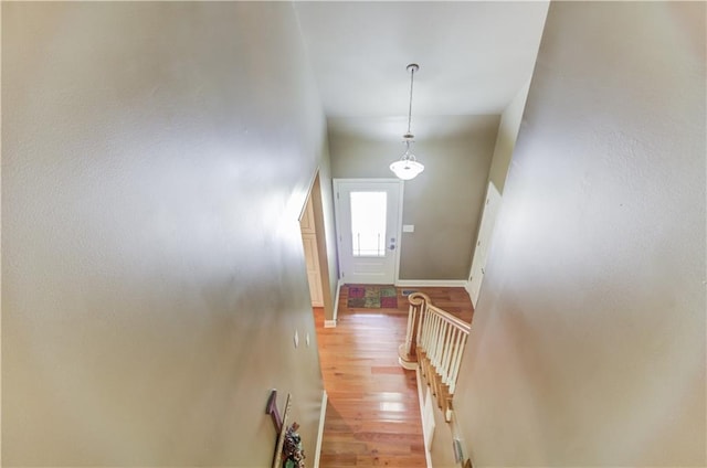 interior space with hardwood / wood-style flooring and a high ceiling