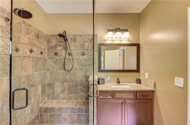 bathroom with vanity and an enclosed shower
