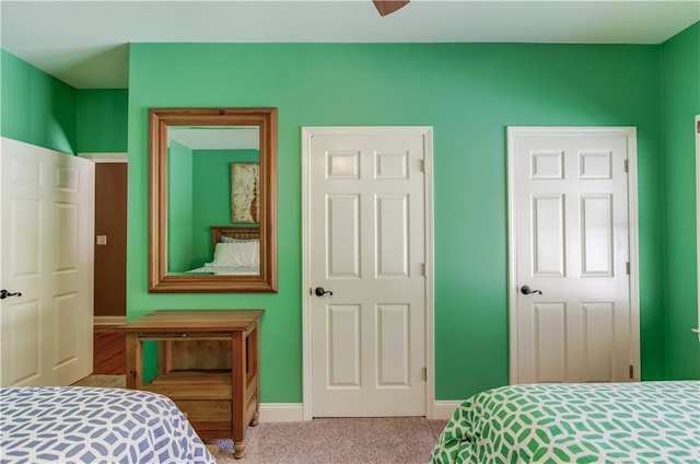 carpeted bedroom with ceiling fan